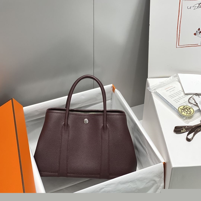 H**mes shopping bags